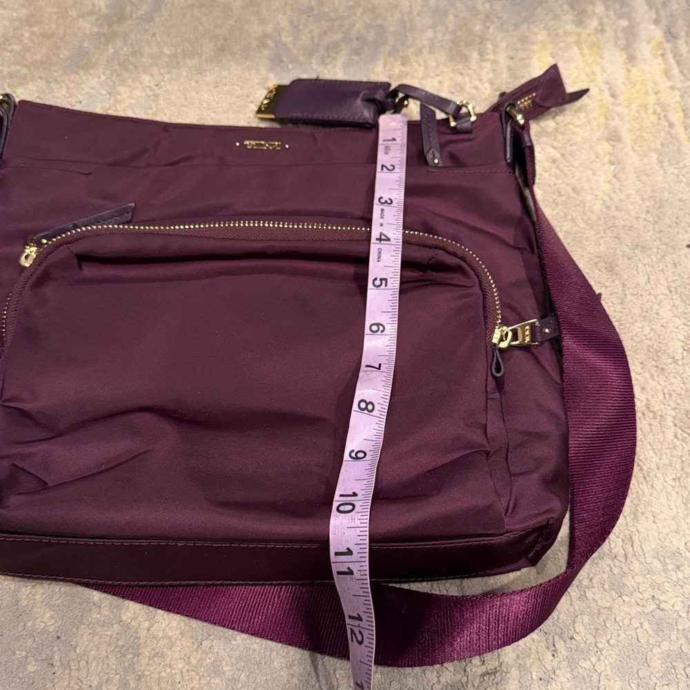 TUMI
Voyageur Capri Crossbody plum purple color in GUC - Picture 11 of 12